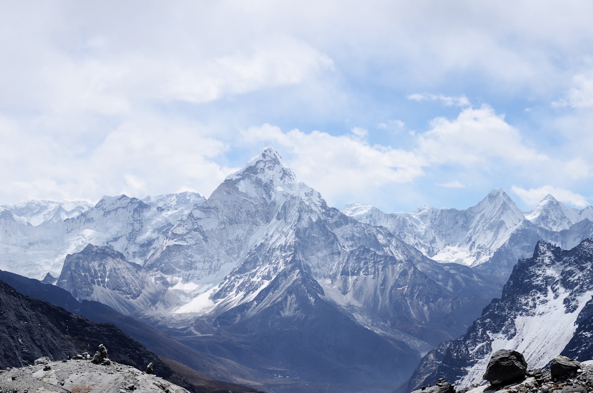 Panoramic view of mountain ranges above the clouds