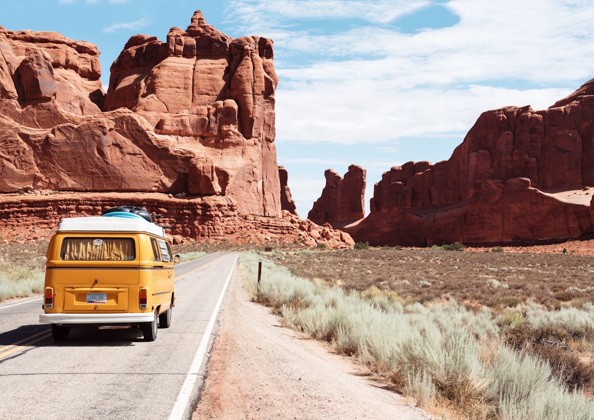 Car road trip through dramatic mountain scenery